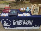 A Sylvan Heights Bird Park table set up with NC SciFest materials