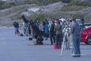 People standing with telescopes