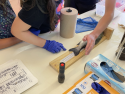 Children measuring a fish