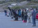 People standing with telescopes