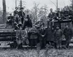 Biltmore Forest School Students in front of a log pile